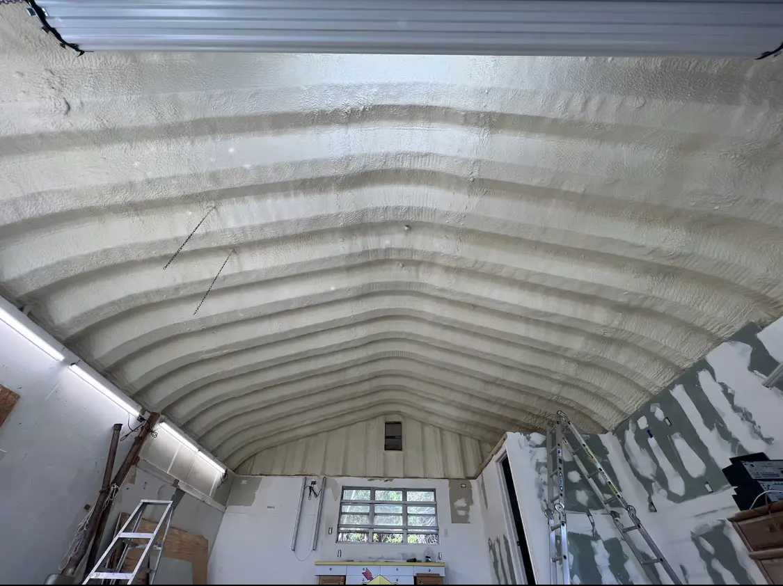 Spray polyurethane foam applied to the underside of a metal roof deck in Highland
